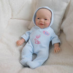 Boneca Bebê Reborn de Silicone Sólido Completo, 20cm, da Blue Bunny, Roupa Fofa de Coelho com Capuz Incluída
